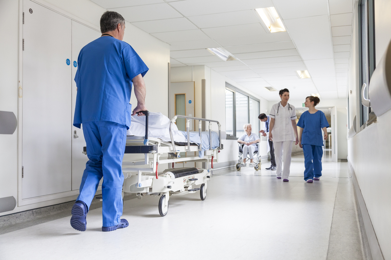 Doctors Hospital Corridor Nurse Pushing Gurney Stretcher Bed - Failure to Treat Attorneys